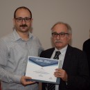 Yrd. Doç. Dr. Cihan Topal belgesini alırken